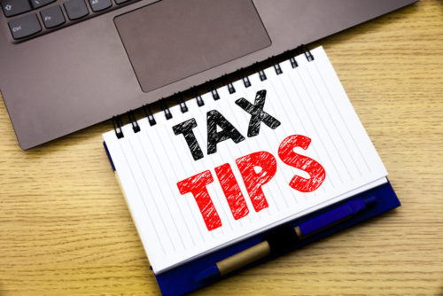 Hand writing text caption inspiration showing Tax Tips.